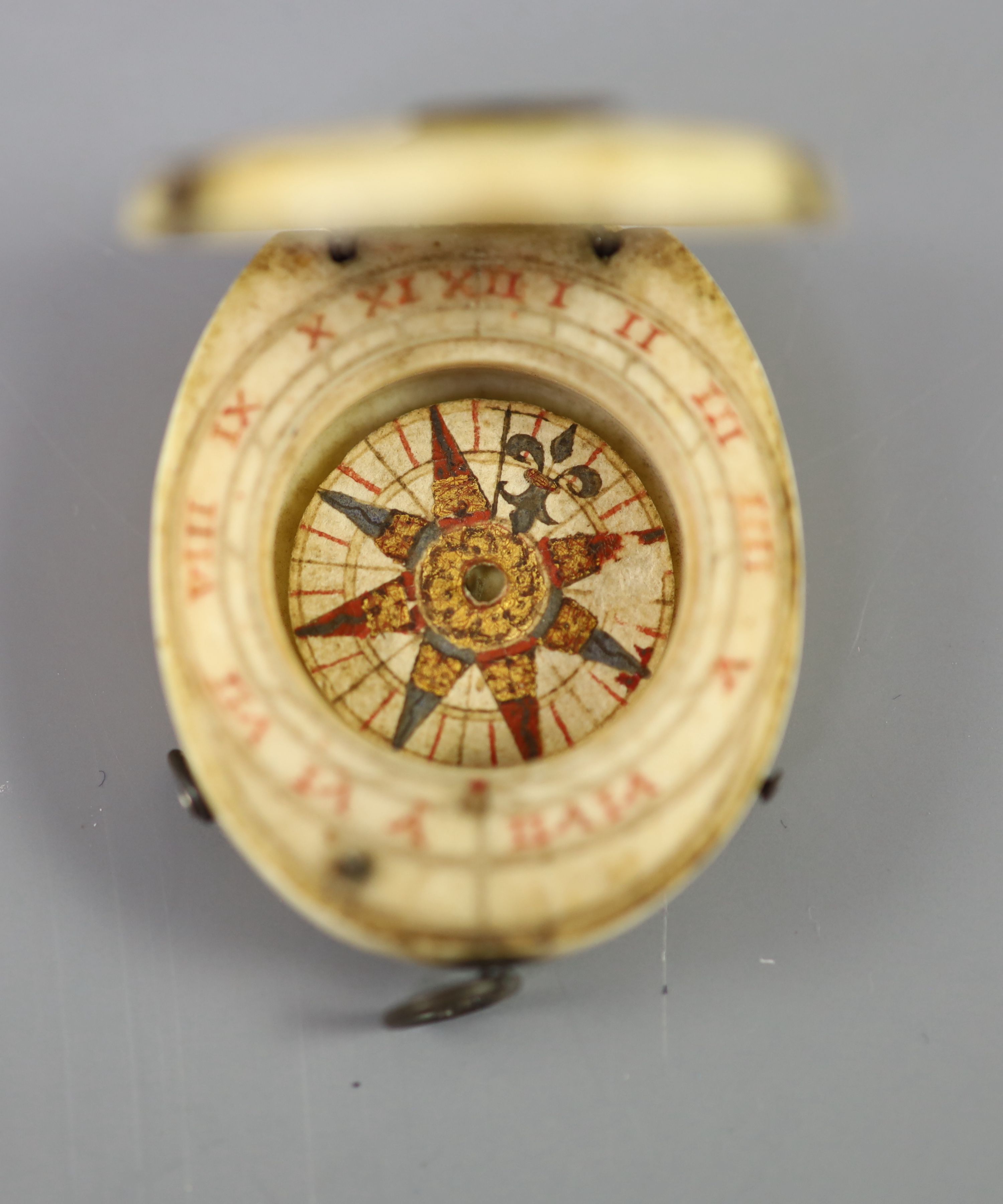 A rare late 16th century German oval ivory diptych-dial, width 39mm depth 48mm length 48mm